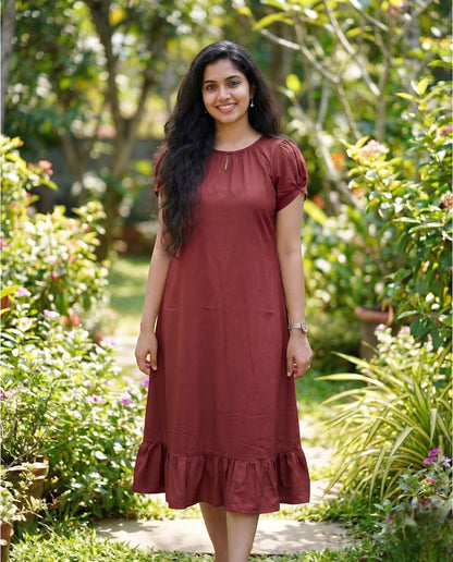 Puff sleeved frock with special neckline and tie back