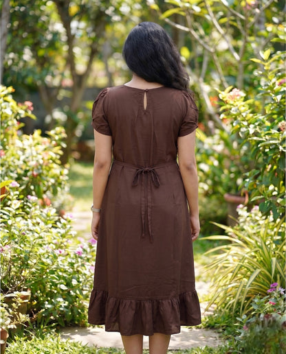 Puff sleeved frock with special neckline and tie back