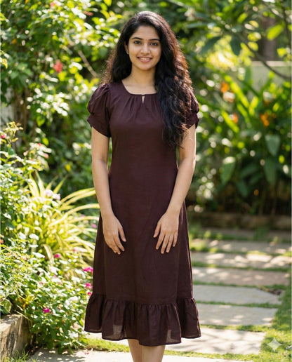 Puff sleeved frock with special neckline and tie back