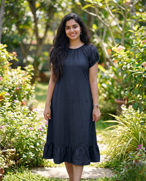Puff sleeved frock with special neckline and tie back