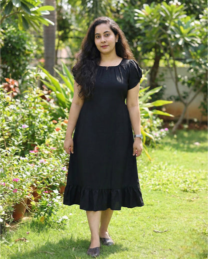 Puff sleeved frock with special neckline and tie back