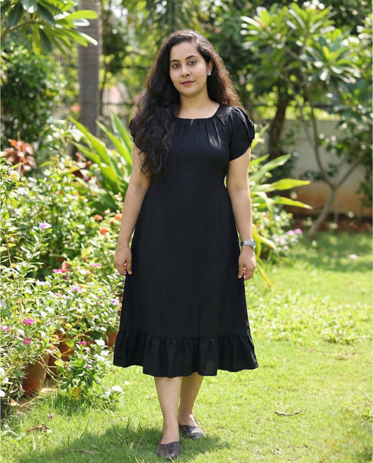 Puff sleeved frock with special neckline and tie back