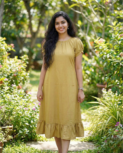 Puff sleeved frock with special neckline and tie back