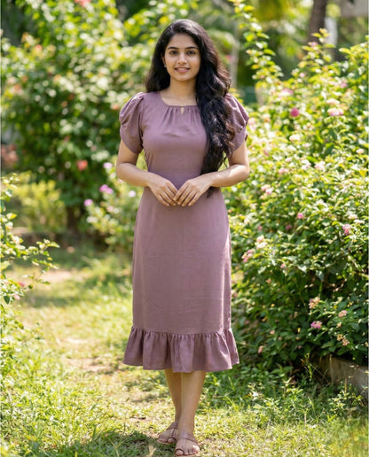 Puff sleeved frock with special neckline and tie back