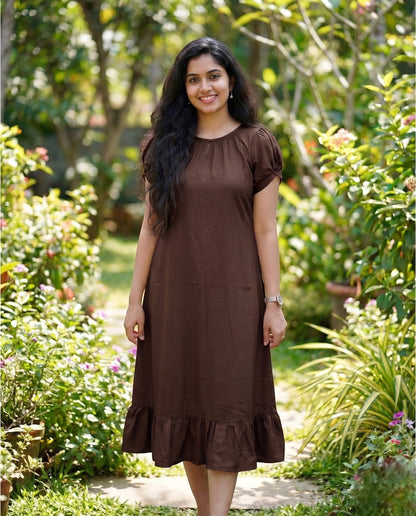 Puff sleeved frock with special neckline and tie back