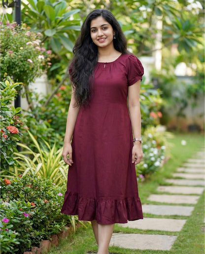 Puff sleeved frock with special neckline and tie back