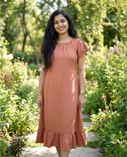 Puff sleeved frock with special neckline and tie back