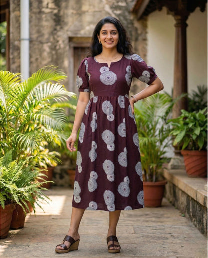 Puff sleeved frock with boat neckline and tie back