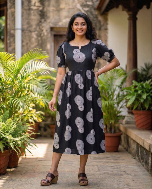 Puff sleeved frock with boat neckline and tie back